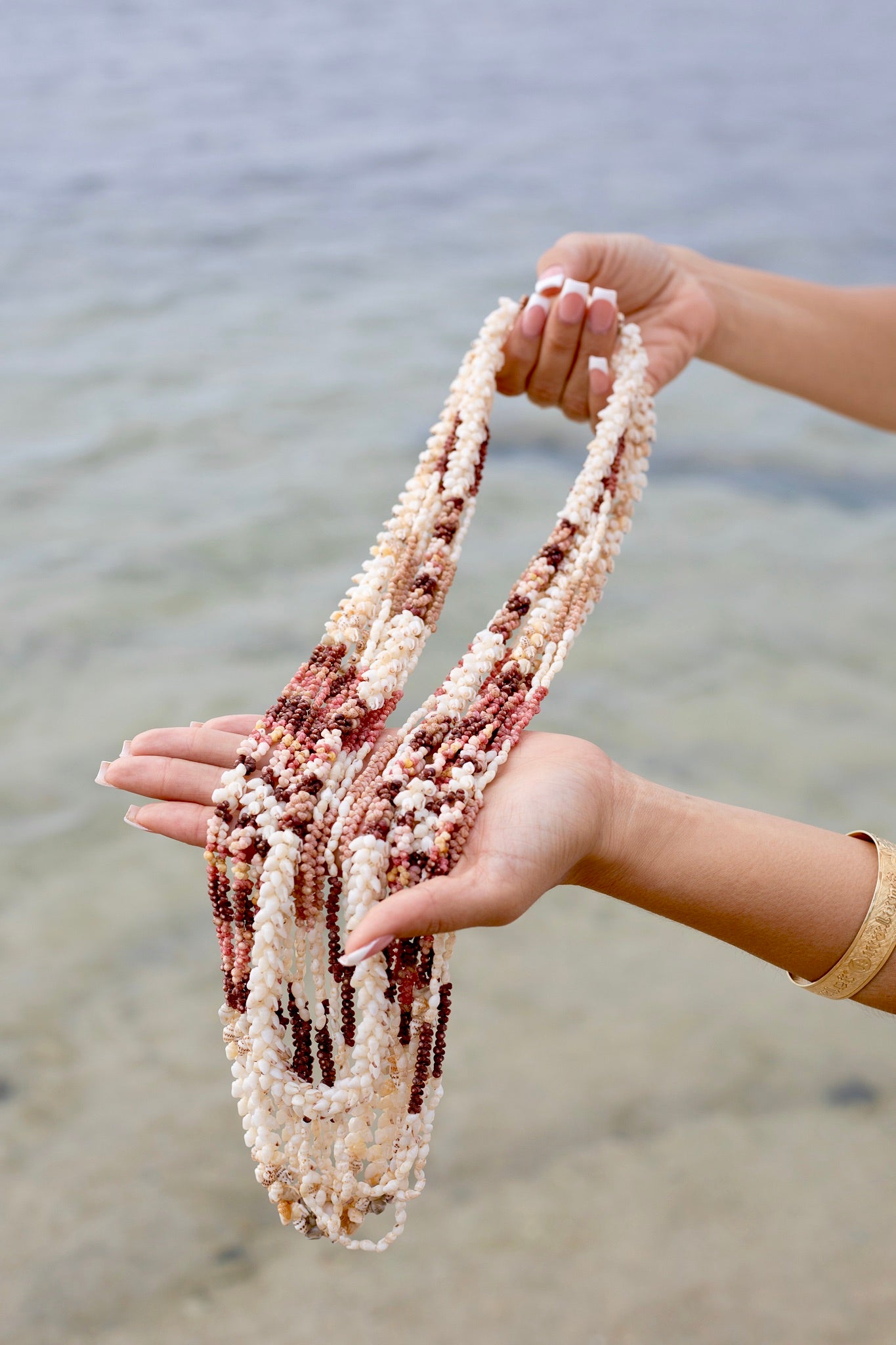 Niihau Shell Leis in a Hand